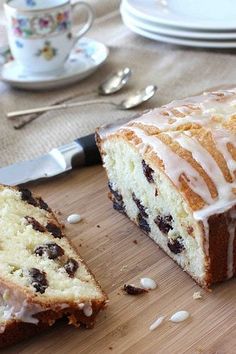 a loaf of cake sitting on top of a wooden cutting board