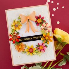 a handmade birthday card with flowers and a ribbon on the front that says happy birthday wishes