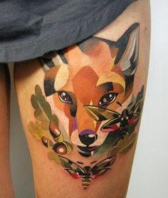 an image of a fox on the side of a woman's leg with tattoos