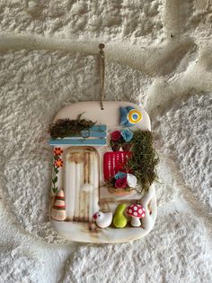 a white tray with some plants and other things on it, sitting on a bed