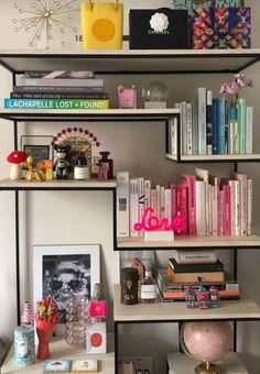 the bookshelf is filled with many different types of books and knick - knacks