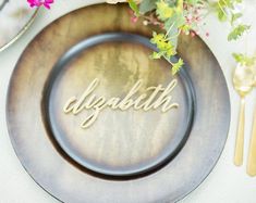 a plate that has some flowers on it and the word doppath written in cursive letters