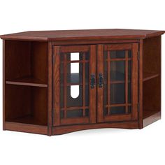 a wooden entertainment center with glass doors