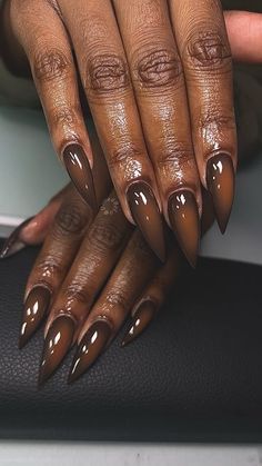 BIG LO the almond slayer on Instagram: "Meltdown., 🍫🤎 . . Knock On Wood” x @chaunlegendnails ✊🏾🪵 . . Pumpkin Chai” x @sugarandcream 🎃☕️ . . Extreme Stiletto Tips x @nailedbycleo_shoppe code: DBL10 . . #brownnails #stilettonails #longnails #xlnails #auranails #prettynails #chocolate #fallnails #fallcolors #fallfashion #fallvibes #dfwnails #dallasnails #dfwnailtech #dallasnailtech #dallasnailartist #irvingnails #lewisvillenails" Clear Brown Nails, Brown Nails Stiletto, Brown Ombre Nails Acrylic, Brown Almond Nails, Brown Ombre Nails, Chocolate Brown Nails, Starbucks Nails, Chocolate Nails, Pedicure Designs Toenails