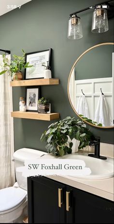 the bathroom is decorated in green and white