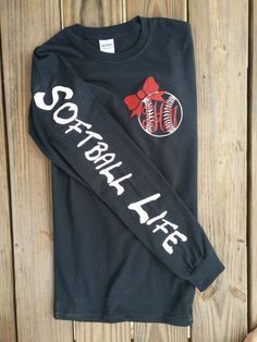 a black long sleeve shirt with the words softball life on it and a red heart