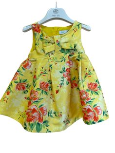 Abel & Lula Baby Girls Yellow Floral Bow Mikado Dress NEW! From Abel & Lula, An exquisite sleeveless dress in a bright yellow floral color and pattern, Bow On The Chest Concealed zipper back. An ideal look to wear on any special occasion. Sizes 12 Months to 36 Months (3 Years) ALSO AVAILABLE IN YOUTH SIZES WITH BELTED WAIST Mikado Dress, End Of Season Sale, Floral Color, Bright Yellow, Yellow Floral, Toddler Girls, 12 Months