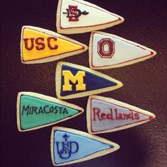 decorated cookies are arranged in the shape of pennants with letters that spell usa, mexico, and redlands