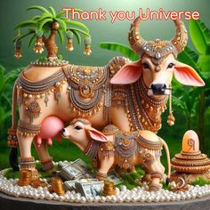 a statue of a bull with jewelry on it's head and the words, thank you universe