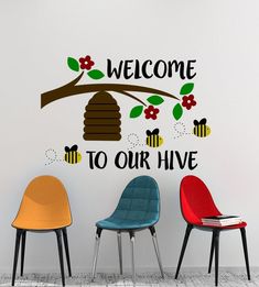 three chairs in front of a wall that says welcome to our hive