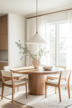 Neutral modern dining room decor with round wood dining table and dining chairs Neutral Dining Table, Modern Dining Room Decor, Round Kitchen Island, Japandi Dining Room, Cozy Dining Room, Modern Round Dining Table, Dining Room Decor Modern, Round Dining Tables, Neutral Dining Room