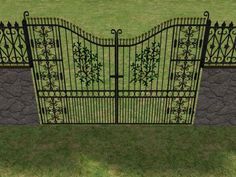 an iron gate is shown in the grass