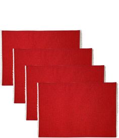 four red placemats with white trim on them