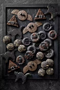 an assortment of buttons and decorations on a black background