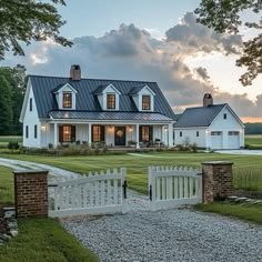 a large white house with a black roof