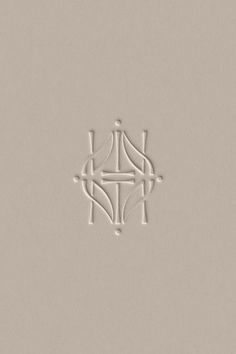 an image of a cross in the middle of a tile wall with lines on it