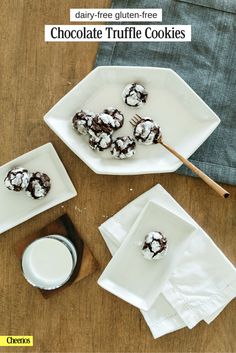 chocolate truffle cookies on white plates next to a glass of milk