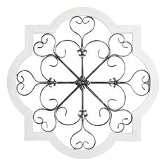 a white and black metal clock with hearts on it's face, isolated against a white background