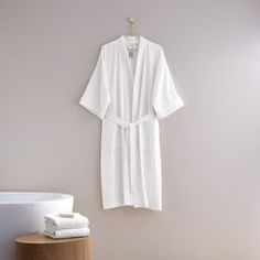 A lightweight robe with roomy kimono sleeves in breathable cotton pique. You will feel cool and comfortable. Light, cool, and breathable. 100% Cotton pique. Expertly made in Turkey. H by Frette Size: L H by Frette Pique Kimono Bathrobe - GLOBAL in White | Size Large | Perigold Toddler Poncho, Kimono Bathrobe, Most Luxurious Hotels, Kimono Sleeves, Baby Organization, Kimono Sleeve, Cozy Fashion, Black Trim, Terry Cloth