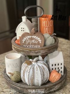 a tray with coffee mugs and other items on it sitting on top of a table