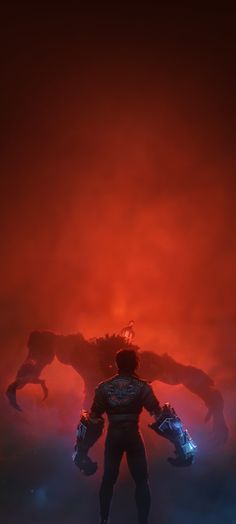 a man standing in front of a giant monster