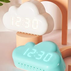 the alarm clock is next to a cloud