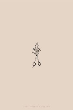 two scissors with flowers on them are in the middle of a wallpapered background