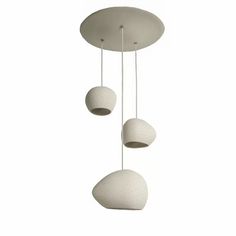 three white balls hanging from the ceiling