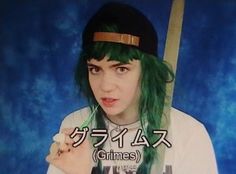 a person with green hair holding a baseball bat in front of a blue background that says chinese