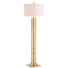 a gold lamp with a white shade on it