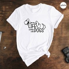 Life Is Better With Dogs Shirt, Dog Lover T-Shirt, Dog Mom Shirt, Pet Lover Shirt - Available In A Wide Range Of Sizes, From S To 3xl, And A Vibrant Array Of Colors, You Can Find The Perfect Fit And Shade To Suit Your Personal Style. - Once You Place Your Order, Our Dedicated Team Will Ensure It Is Promptly Processed And Shipped To Your Doorstep. - If You Need To Make Any Changes To Your Order, Simply Let Us Know After Your Purchase, And We'll Be More Than Happy To Assist You. Dog T Shirt Design, Dog Tshirt Ideas, T Shirt Dog Design, Cute White Tops With Dog Print, White Cotton Top With Dog Print, Dog Shirt Sayings For Dogs, Dog Lover Shirt Ideas, White Crew Neck Top With Dog Print, White Short Sleeve Tops With Dog Print