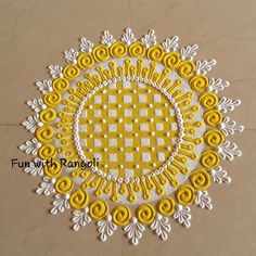 a yellow and white doily on a table