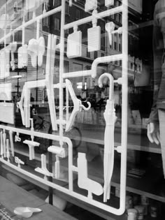 there is a display in the window of a store with many different types of pipes and fittings