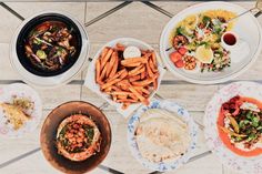 an overhead view of several plates of food