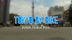 the words tokyo by bike are displayed in front of a blurry image of a cityscape