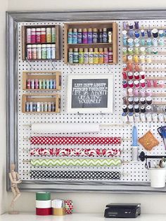 the peg board is organized with craft supplies