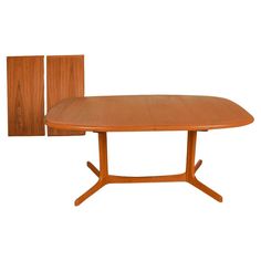 an oval wooden table with two doors on each side