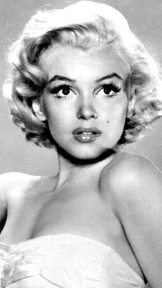 a black and white photo of a woman with blonde hair