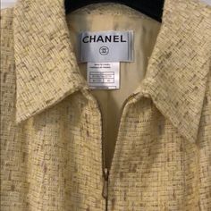 Vintage Chanel Yellow Jacket - Size: 42 - Color: Yellow - Material: 72% Rayon, 28% Cotton - Detailing: Zip Closure Halfway Down Center, Front Pockets, Cuffed Sleeves - Fit: A Line - Length: Knee - Lining: Fully Lined, 100% Silk Lining - Condition: Excellent - Made In France Affordable Yellow Vintage Outerwear, Vintage Fitted Yellow Outerwear, Luxury Vintage Gold Outerwear, Luxury Double-breasted Outerwear With Gold Buttons, Chanel Yellow, Luxury Yellow Vintage Outerwear, Chanel Jackets, Coats Vintage, Chanel Jacket