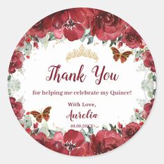 a round thank sticker with red flowers and butterflies on the front, in gold lettering