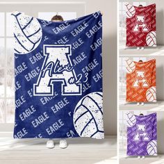 an image of a hooded blanket with basketballs and letters on it in multiple colors