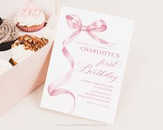 a box filled with lots of cupcakes next to a card