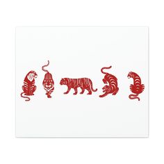 three red and white paper cut animals on a white background