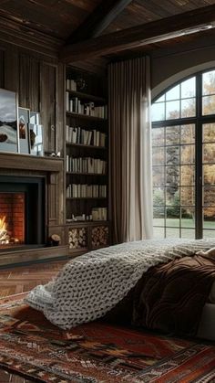 a bedroom with a fireplace and large windows