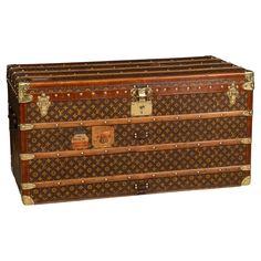 an old louis vuitton trunk is shown with gold trimmings and handles