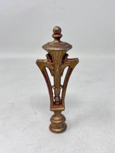 an old fashioned brass candle holder on a white background