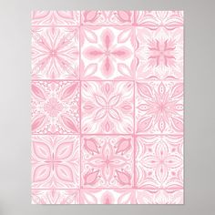 a pink and white wall hanging on the side of a wall next to a vase