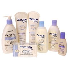 an assortment of skin care products displayed on a white background with the words aveeno written in blue