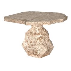 a stone table with a large rock on it's top and base in the shape of a hexagonal object