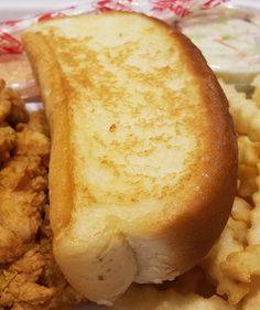 a close up of a sandwich on a plate with fried chicken and waffles